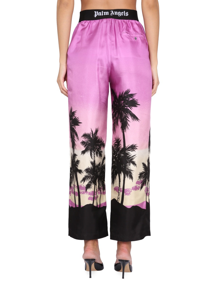 Palm Angels PANTS WITH SUNSET PRINT PWCA110S23FAB0013701